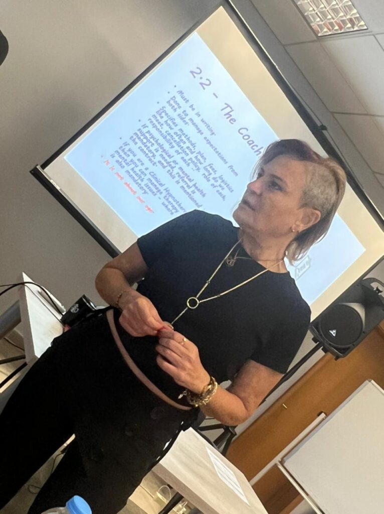 Coach Bee delivering NLP training